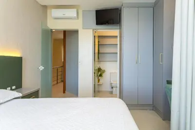 Uma cama ou camas num quarto em Condomínio Costão Náutico