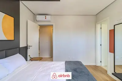 Uma cama ou camas num quarto em Apartamento novíssimo a 5 minutos Barra Sul