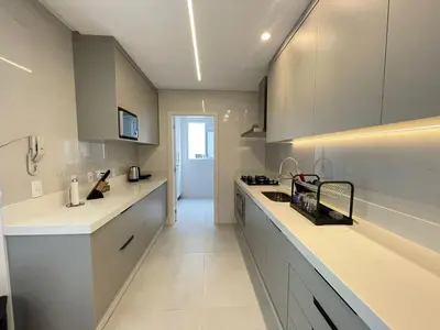 A cozinha ou kitchenette de Vista Mar - 4 Suites em Itapema