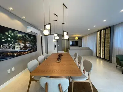 Uma área de estar em Vista Mar - 4 Suites em Itapema