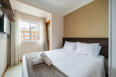 Uma cama ou camas num quarto em Achei Itapema • Residencial Olympio, R.255
