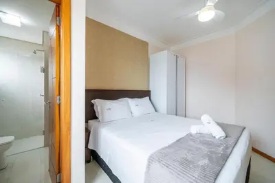 Uma cama ou camas num quarto em Achei Itapema • Residencial Olympio, R.255