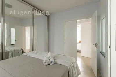 Uma cama ou camas num quarto em Casa ampla a 100m da praia – Conforto e lazer