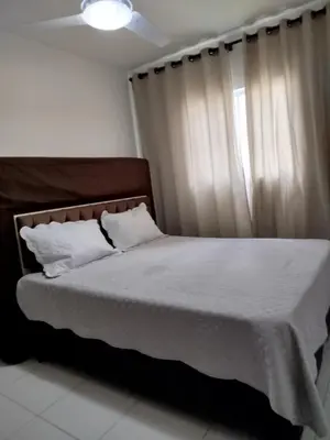 Uma cama ou camas num quarto em Condomínio Boulevard das Palmeiras
