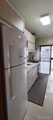 A cozinha ou kitchenette de Apartamento elegante perto do mar