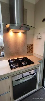 A cozinha ou kitchenette de Apartamento elegante perto do mar