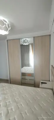 Uma cama ou camas num quarto em Apartamento elegante perto do mar