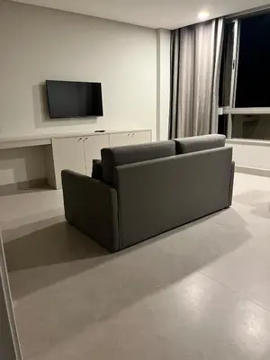 Uma televisão e/ou sistema de entretenimento em Bombinhas Flat 4 pessoas