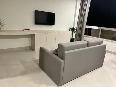 Uma televisão e/ou sistema de entretenimento em Bombinhas Flat 4 pessoas