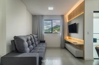 Uma televisão e/ou sistema de entretenimento em Apto 2Q c/ varanda prox ao mar Itapema MTS1503