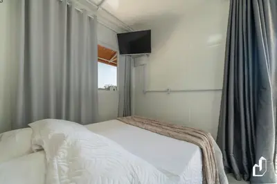 Uma cama ou camas num quarto em Residencial Lynary – Loft Júpiter
