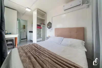 Uma cama ou camas num quarto em Residencial Lynary – Loft Júpiter