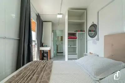 Uma cama ou camas num quarto em Residencial Lynary – Loft Júpiter