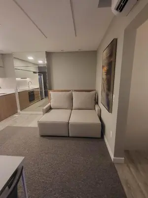 Uma área de estar em Flat Tower Infinity Meia Praia