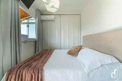 Uma cama ou camas num quarto em Residencial Lynary – Loft Marte