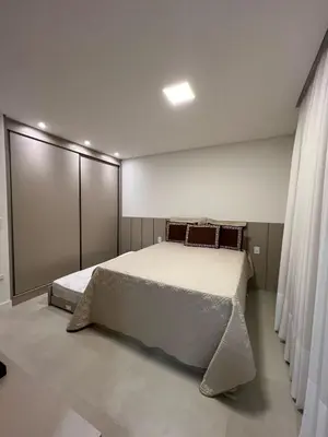 Uma cama ou camas num quarto em Apartamento Luxo 3 suítes