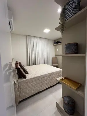 Uma cama ou camas num quarto em Apartamento Luxo 3 suítes
