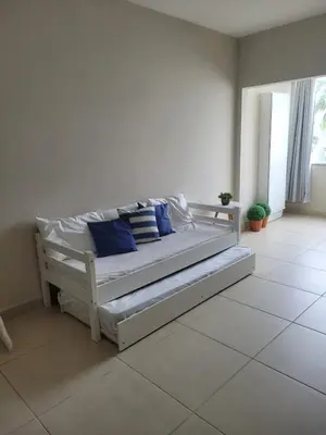 Uma cama ou camas num quarto em Pousada Jardim