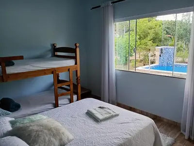 Uma cama ou camas num quarto em Casa Inteira - 3 Quartos - 11 Pessoas - Piscina infantil - 200m da praia