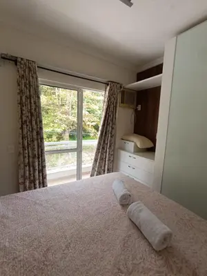 Uma cama ou camas num quarto em Aquarius bombinhas