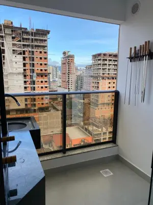 Uma varanda ou terraço em Apto Kairós Beach Stay - Piscina e Churrasqueira