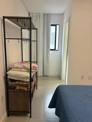 Uma cama ou camas num quarto em Apto Kairós Beach Stay - Piscina e Churrasqueira
