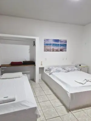 Uma cama ou camas num quarto em Pousada Martanha