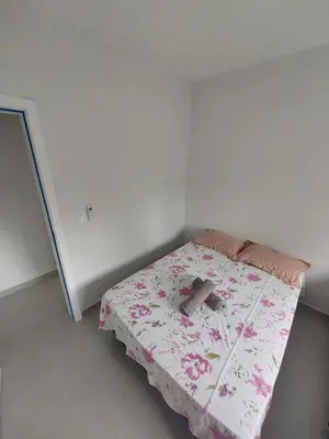 Uma cama ou camas num quarto em Apartamento Bosque das Oliveiras - Palmas