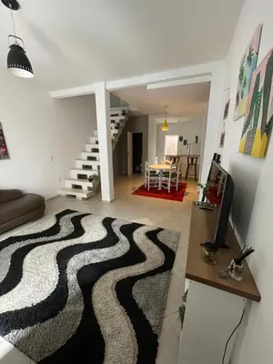 Uma televisão e/ou sistema de entretenimento em Casa 2 suítes