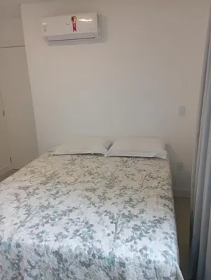 Uma cama ou camas num quarto em Apartamento na Praia de Itapema