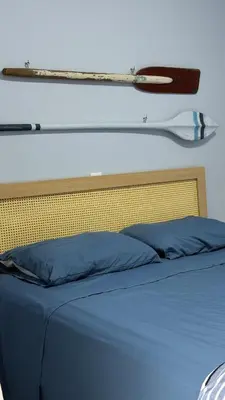 Uma cama ou camas num quarto em Bromélia 106