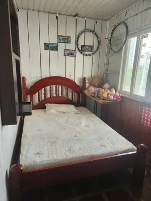 Uma cama ou camas num quarto em House in Itapema half beach