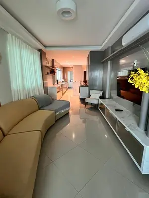 Uma área de estar em Itapema Sea Front Apartment