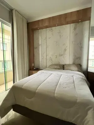 Uma cama ou camas num quarto em Itapema Sea Front Apartment