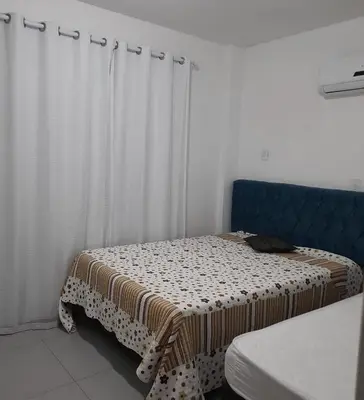 Uma cama ou camas num quarto em Apê Charmoso a Passos do Mar Aproveite Itapema!