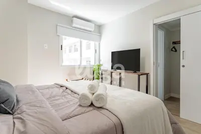 Uma cama ou camas num quarto em Refúgio Marítimo na praia - Balneário Camboriú