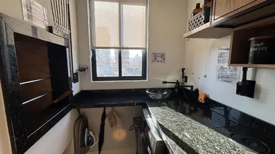 A cozinha ou kitchenette de Porto Industrial: A/C | Vaga | Praia a 400m
