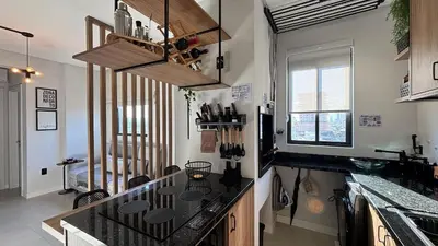 A cozinha ou kitchenette de Porto Industrial: A/C | Vaga | Praia a 400m
