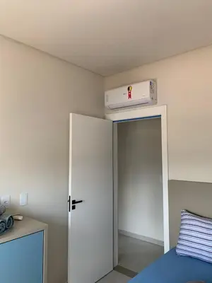 Uma cama ou camas num quarto em Apartamento perto da praia Porto Belo, Santa Catarina