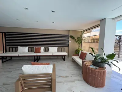 Uma área de estar em Palmas - Apto de praia moderno em HomeClub a 550m do mar