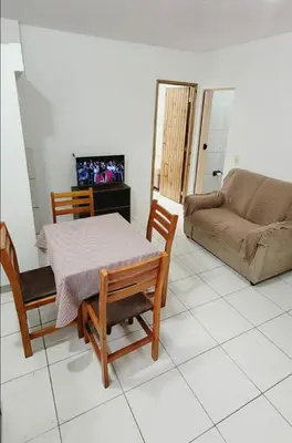 Uma televisão e/ou sistema de entretenimento em Ap 34 in Barra with access to the best beaches in BC