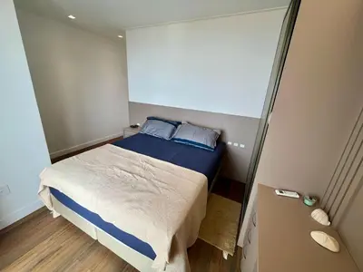 Uma cama ou camas num quarto em Cobertura Partenon 203