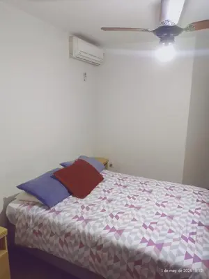 Uma cama ou camas num quarto em Apartamento Res Acapulco Bombinhas