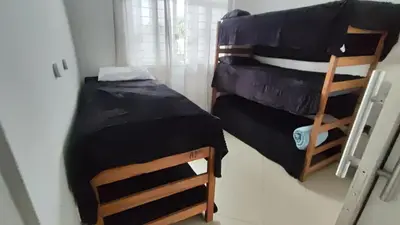 Uma cama ou camas num quarto em Cama Quarto Coletivo Hostel ou Quarto até 4 pessoas e Piscina Pousada Tijucas Lua Encantada
