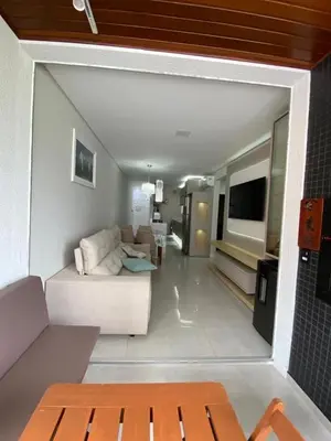 Uma televisão e/ou sistema de entretenimento em Cód 132 - Apartamento aconchegante a 350 metros