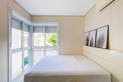 Uma cama ou camas num quarto em Praia de Palmas, 250m do Mar, Ideal para Família, 0194