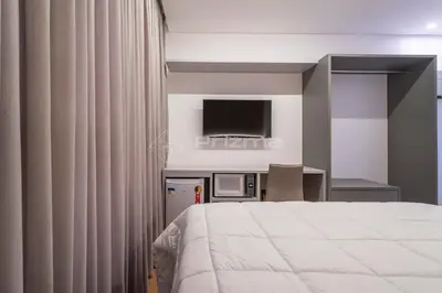 Uma cama ou camas num quarto em 305 Suíte em Localização Incrível Praia de Bombinhas a 120m