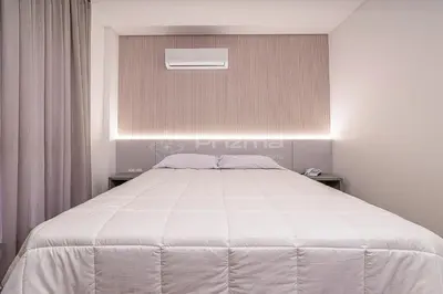 Uma cama ou camas num quarto em 308 Suíte em Localização Incrível Praia de Bombinhas a 120m