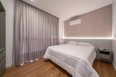 Uma cama ou camas num quarto em 308 Suíte em Localização Incrível Praia de Bombinhas a 120m