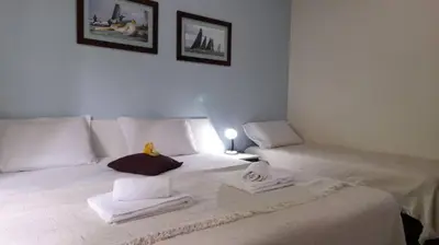 Uma cama ou camas num quarto em Amarra 69 Bombinhas Residence Setor Vintage - Apartamento Familiar no Centro, perto da Praia